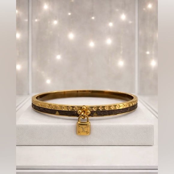 Jewelry - Gold toned and Brown Bangle Bracelet with Lock Charm